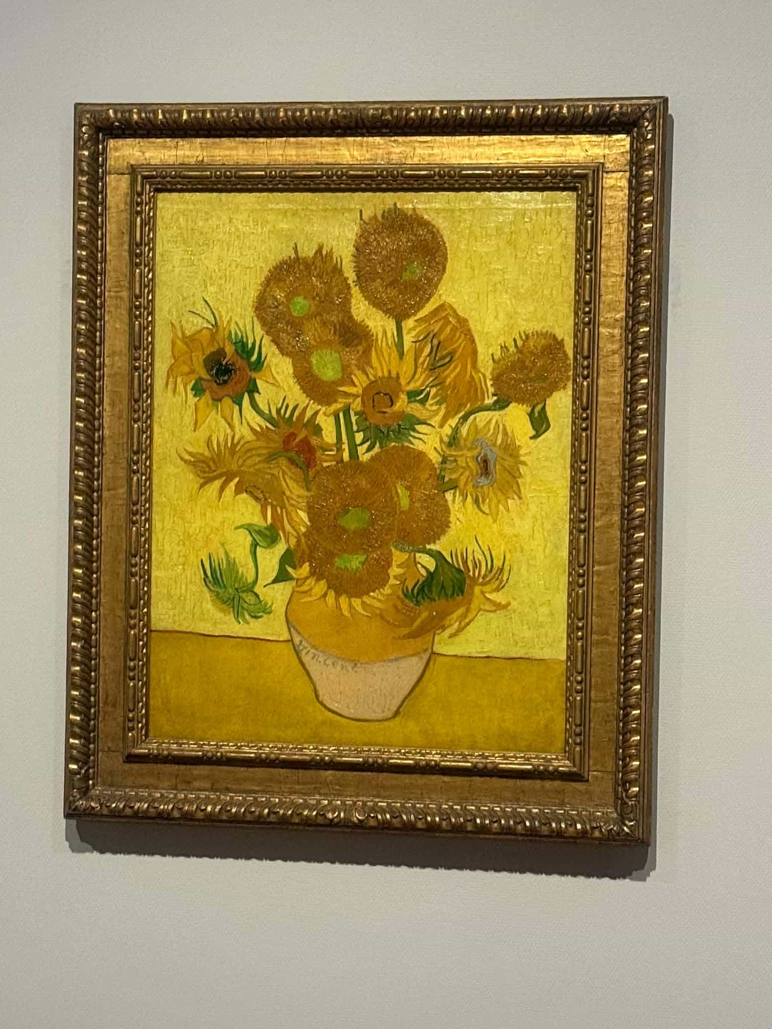 Vincent van Gogh&rsquo;s Sunflowers in its gilded frame on the wall of the Van Gogh Museum in Amsterdam - the painting Andrew almost walked straight past